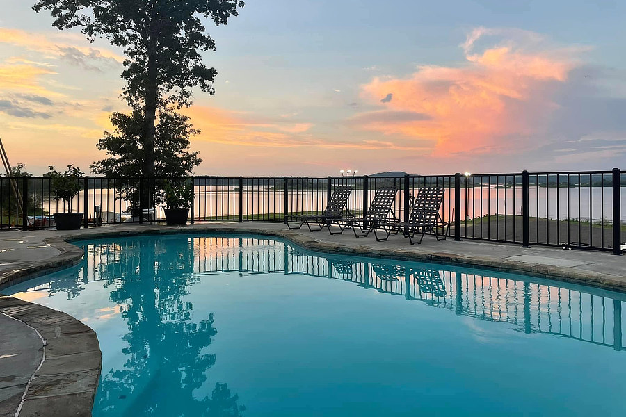 Swimming Pool with lake in background